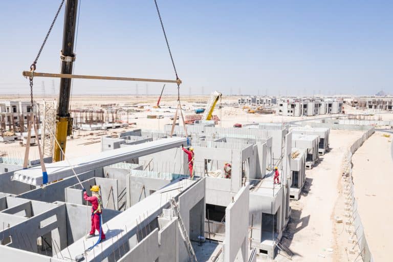 Installing a precast hollow core slab in a construction site in UAE