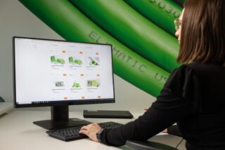 A person working on computer and using training library services