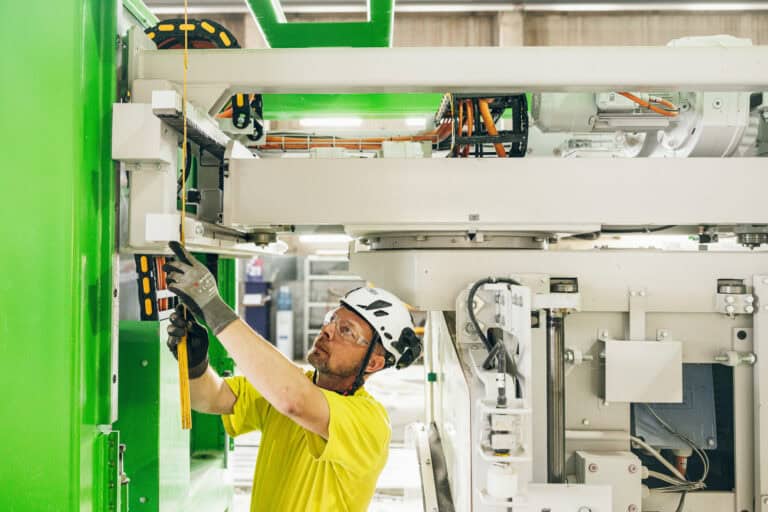 A service manager maintaining precast production lines