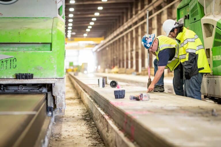 Elematic service engineer on a service visit at a hollow core precast plant.